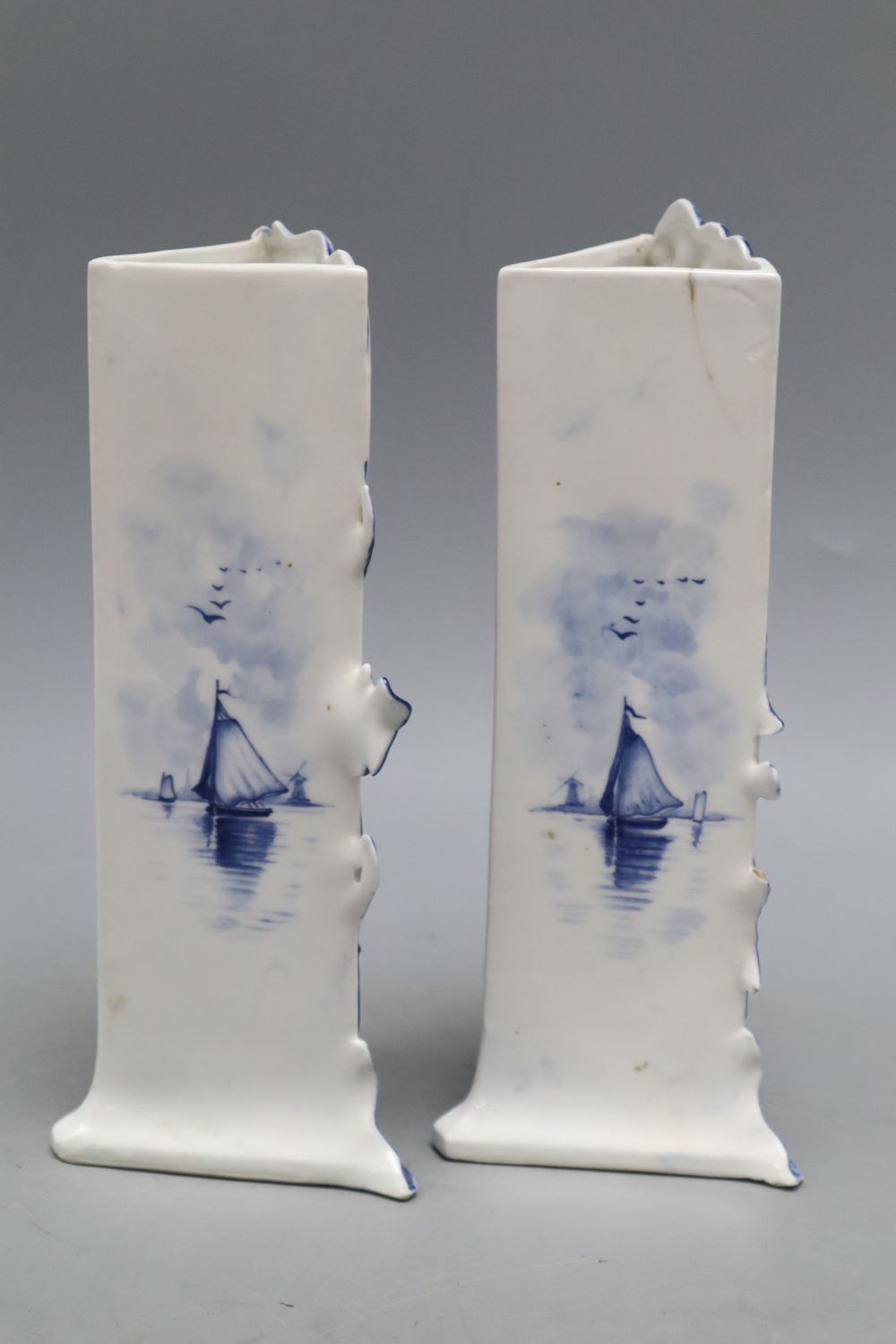 A pair of Delft Art Nouveau blue and white vases, height 21cm